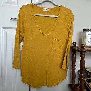 Yellow Anthropologie v-neck pocket tee.
